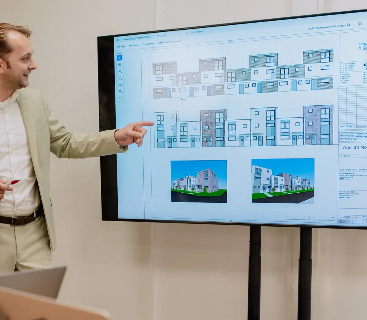 Präsentation der Ansichten und Visualisierungen eines Neubauprojekts mit Reihenhäusern
